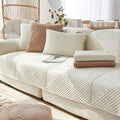 Seduta imbottita con braccioli rivestimento in tessuto beige